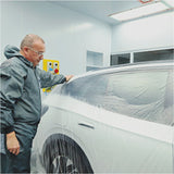 Indasa Cover Roll HDPE Masking Film, technician pulling film over back of car